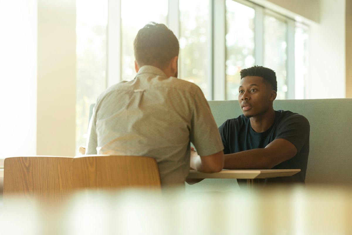Two people talking in an office